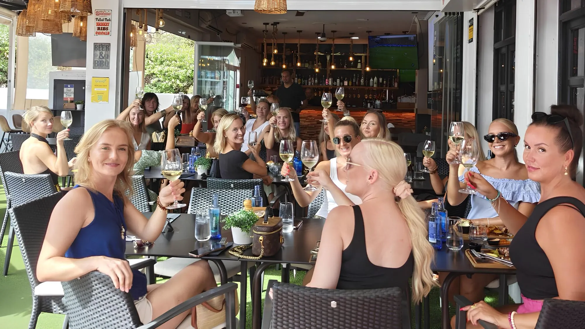 Guests raising a toast on the ClubRoom1 terrace